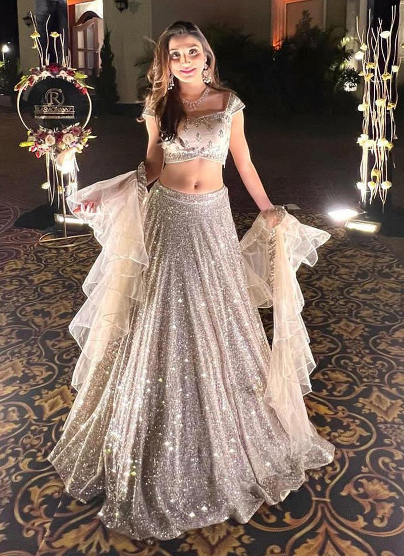 Heavy Sequins Sleeveless Cream Flared Lehenga Choli Sale For Nice